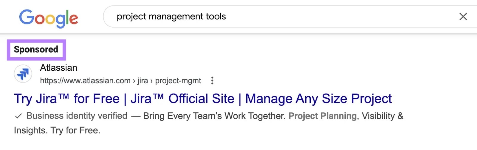 Google SERP for the query "project management tools" with the "Sponsored" tag on the first result highlighted.